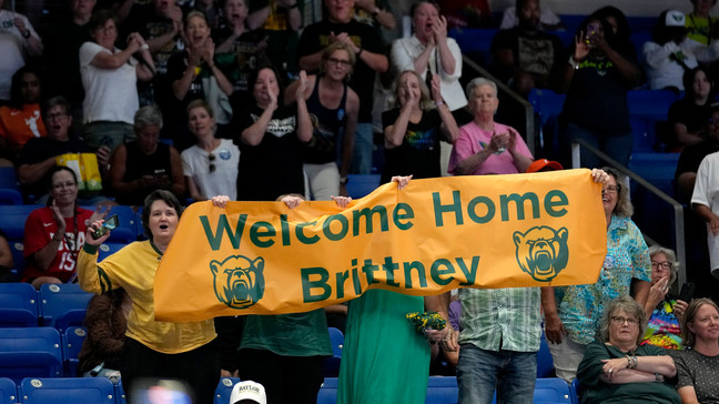 FILE - Fans hold up a sign after Brittney Griner was introduced in the Phoenix Mercury starting lineup for a WNBA basketball game against the Dallas Wings, Wednesday, June 7, 2023, in Arlington, Texas. (AP Photo/Tony Gutierrez)