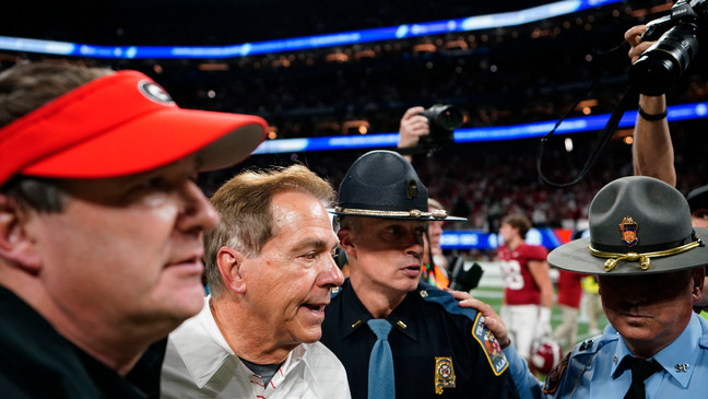 Georgia head coach Kirby Smart, left, and Alabama head coach Nick Saban, right, walk after the Southeastern Conference championship NCAA college football game in Atlanta, Saturday, Dec. 2, 2023. (AP Photo/Brynn Anderson)