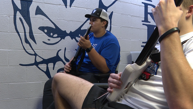 Gate City basketball manager Jacob "Bobo" Bowman playing guitar hero with a teammate (WCYB Photo)