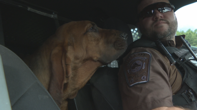 K-9 Boone and his handler, Sgt. Mikhael Tabor. (WCYB)