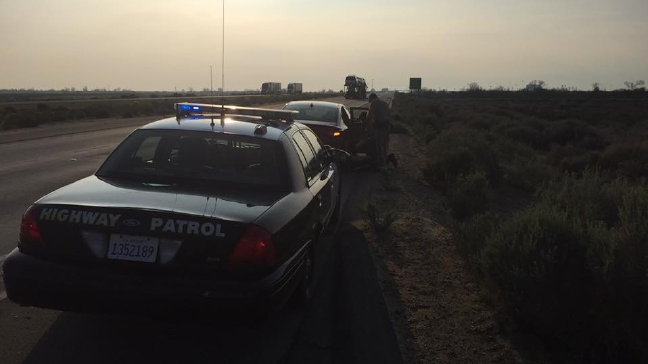California Highway Patrol officers delivered a healthy baby boy on the side of a Kern County freeway, Tuesday, Feb. 14, 2017. (California Highway Patrol - Buttonwillow)