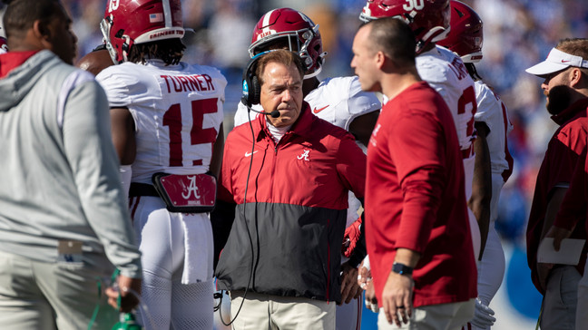 Alabama head coach Nick Saban stands in a huddle during the first half of an NCAA college football game against Kentucky in Lexington, Ky., Saturday, Nov. 11, 2023. (AP Photo/Michelle Haas Hutchins)