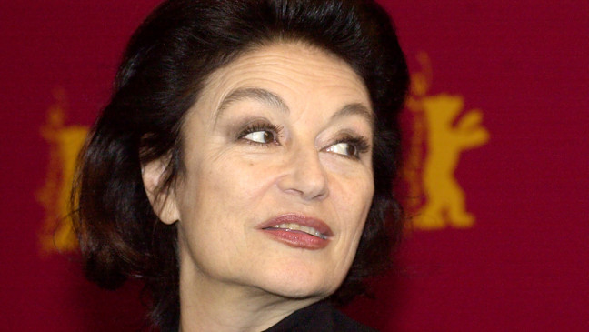 FILE - French actress Anouk Aimee is seen prior to a media conference at the 53rd Berlinale Film Festival in Berlin Thursday, Feb. 13, 2003. Later this evening she will be honored with a Golden Bear award for her lifetime achievements. French actress Anouk Aimée, winner of a Golden Globe for her starring role in "A Man and a Woman" by legendary French director Claude Lelouch, has died, her agent said Tuesday. She was 92. (AP Photo/Sven Kaestner, File)