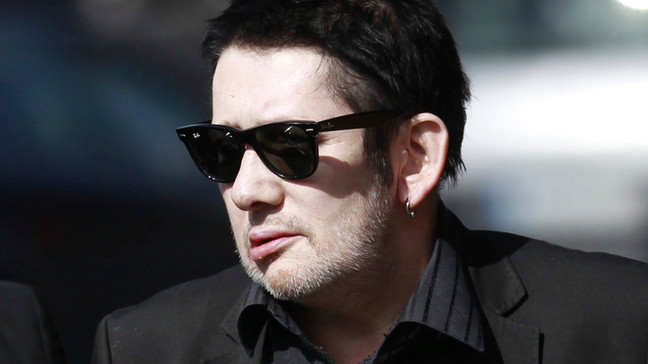 FILE - Irish singer Shane MacGowan attends the funeral mass of Irish poet Seamus Heaney at the Church of the Sacred Heart in Donnybrook, Dublin, Ireland, Monday, Sept. 2, 2013.{&nbsp;} (AP Photo/Peter Morrison, File)