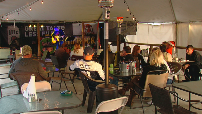 Jeff Lanham has been living on the roof of his restaurant/bar for a month now after pledging to sleep on the roof until the team wills following the team's week five loss to Arizona. (WKRC)