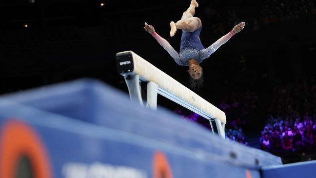 United States' Simone Biles competes on the beam during the women's team final at the Artistic Gymnastics World Championships in Antwerp, Belgium, Wednesday, Oct. 4, 2023. (AP Photo/Geert vanden Wijngaert)