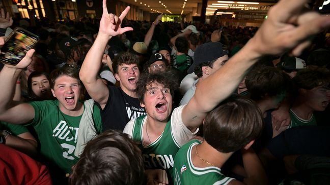 Boston Celtics fans react following the Celtics victory over the Dallas Mavericks in Game 5 of the NBA basketball finals in Boston on Monday, June 17, 2024. (AP Photo/Josh Reynolds)