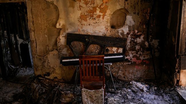 Destroyed furniture and charred walls are seen in a home that came under attack during a massive Hamas invasion into Kibbutz Nir Oz, Israel, Thursday, Oct. 19, 2023. (AP Photo/Francisco Seco)