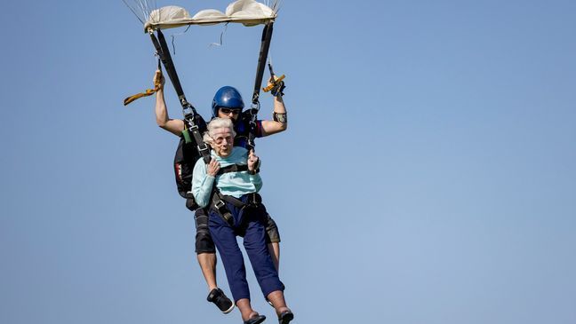 Dorothy Hoffner, 104, becomes the oldest person in the world to skydive with tandem jumper Derek Baxter on Sunday, Oct. 1, 2023, at Skydive Chicago in Ottawa, Ill. (Brian Cassella/Chicago Tribune via AP)