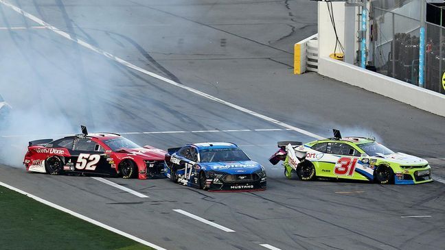 Cody Ware wrecks coming into pit road with Ricky Stenhouse Jr. (17) and Tyler Reddick (31) during a NASCAR Daytona 500 auto race at Daytona International Speedway, Sunday, Feb. 17, 2019, in Daytona Beach, Fla. (AP Photo/David Graham)