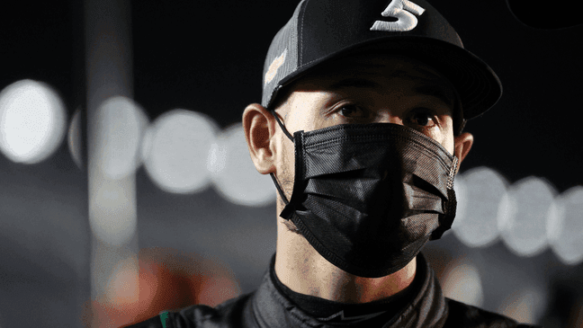 DAYTONA BEACH, FLORIDA - FEBRUARY 10: Kyle Larson, driver of the #5 Nations Guard Chevrolet, stands on the grid during qualifying for the NASCAR Cup Series 63rd Annual Daytona 500 at Daytona International Speedway on February 10, 2021 in Daytona Beach, Florida. (Photo by Chris Graythen/Getty Images){p}{/p}