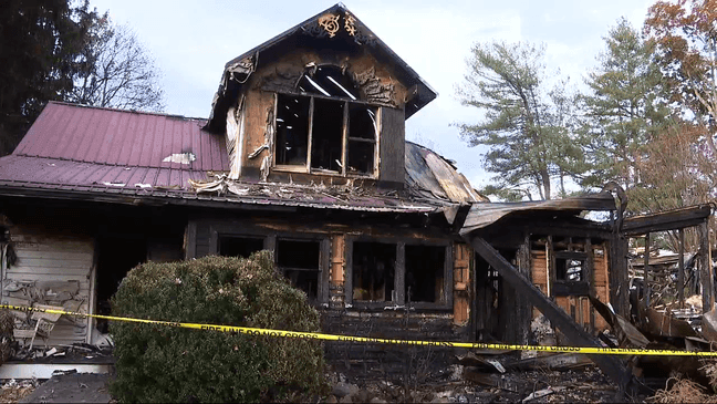 OCT. 25, 2022 - For nearly six hours Saturday night, firefighters from 10 departments fought to put out a blaze that engulfed a two-story home at The Farm on Justice Ridge Road. (Photo credit: WLOS staff){p}{/p}