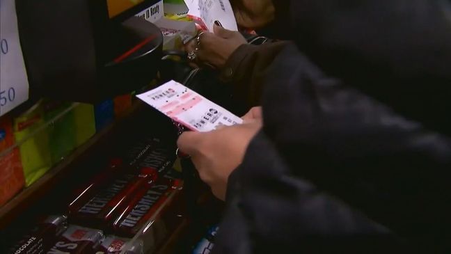 A crazy night of Powerball included a strange delay and a historic winner. (7News)