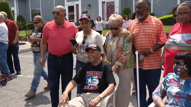 Surrounded by loved ones, Butler enjoys his celebration. (WJAR)