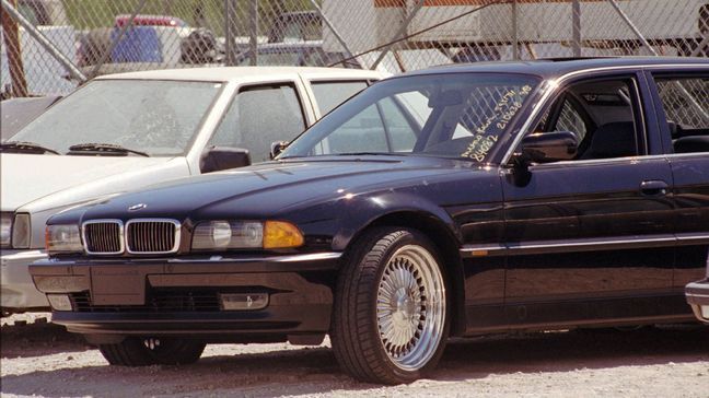 FILE - In this Sept. 8, 1996, file photo, a black BMW, riddled with bullet holes, is seen in a Las Vegas police impound lot. (AP Photo/Lennox McLendon, File)