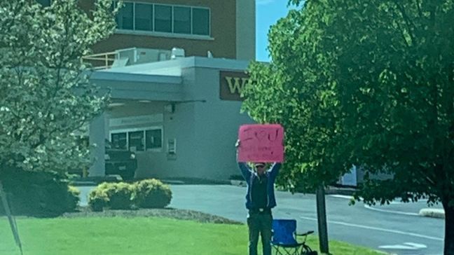 Although Daryl can't be inside the hospital due to restrictions, he's sitting outside of Pearson Cancer Center where his wife, Johanna, is getting chemo with a sign that says "I love you" (Provided by Calfees)