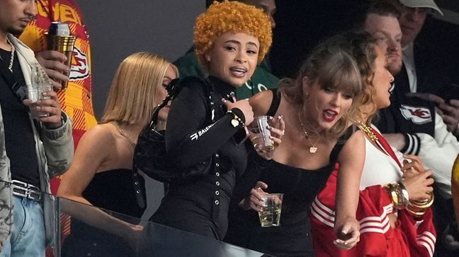 Ice Spice, left, and Taylor Swift talk before the NFL Super Bowl 58 football game between the San Francisco 49ers and the Kansas City Chiefs, Sunday, Feb. 11, 2024, in Las Vegas. (AP Photo/George Walker IV)