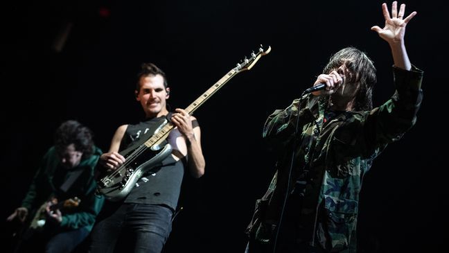 From L-R, Ray Toro, Mikey Way and Gerard Way of My Chemical Romance performs at the Moda Center in Portland, Ore. (Photo by Tristan Fortsch for KATU)