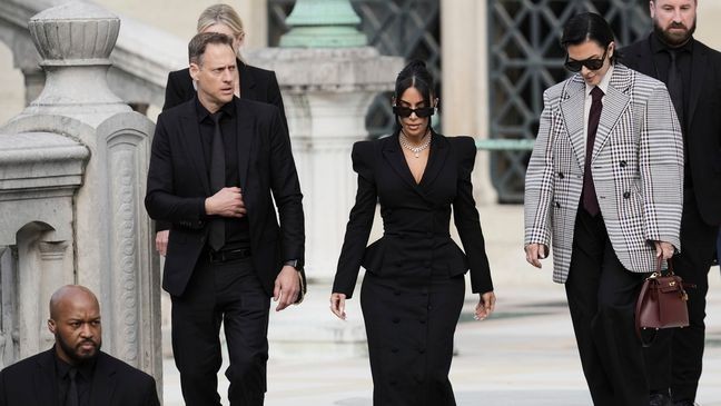Kim Kardashian, center, accompanied by her mother Kris Jenner, second right, leaves the justice palace after testifying, regarding a robbery of millions of dollars in jewels from her Paris hotel room in 2016, in Paris, Tuesday, May 13, 2025. (AP Photo/Aurelien Morissard)