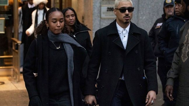 Chance Combs, left, daughter, and Quincy Brown, right, stepson of Sean "Diddy" Combs leave Manhattan federal court, Friday, Nov. 22 2024, in New York. (AP Photo/Yuki Iwamura)