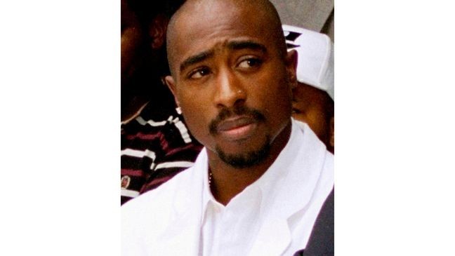 FILE - Rapper Tupac Shakur attends a voter registration event in South Central Los Angeles, Aug. 15, 1996. (AP Photo/Frank Wiese, File)