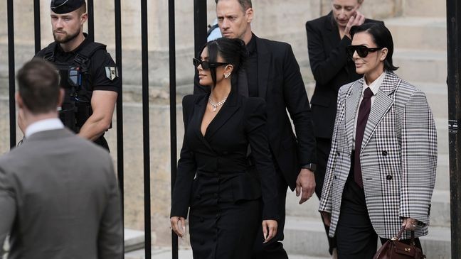 Kim Kardashian, center, accompanied by her mother Kris Jenner, right, leaves the justice palace after testifying, regarding a robbery of millions of dollars in jewels from her Paris hotel room in 2016, in Paris, Tuesday, May 13, 2025. (AP Photo/Aurelien Morissard)