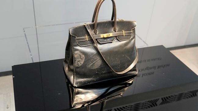 The original Birkin bag created by Hermès for Jane Birkin in 1984 is displayed prior to its auction Thursday, July 10, 2025 in Paris. (AP Photo/Michel Euler)
