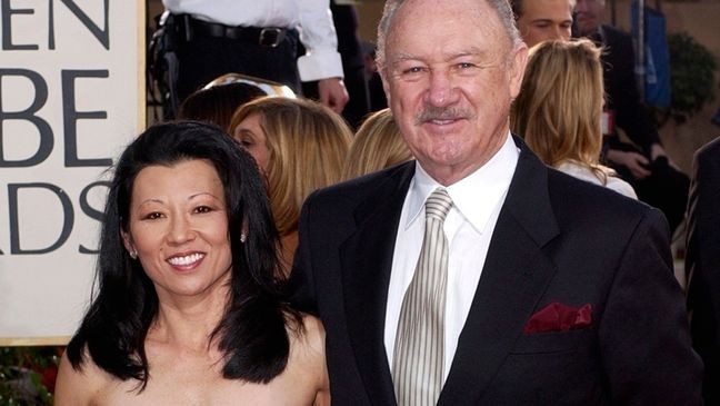 FILE - Actor Gene Hackman arrives with his wife, Betsy Arakawa, for the 60th Annual Golden Globe Awards in Beverly Hills, Calif., Jan. 19, 2003. (AP Photo/Mark J. Terrill, File)