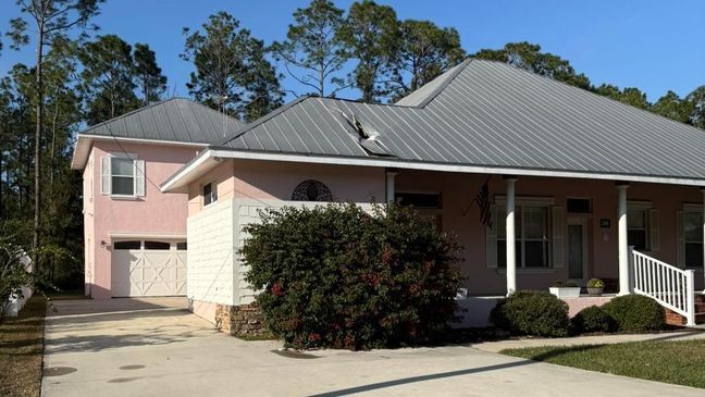 At the scene, the Fire Department discovered a large hole in the metal roof and remnants of ice had gotten into the living quarters. Photos show the damage the ice left to the home, with a large hole in the roof at the front of the house. (Palm City Fire Department)