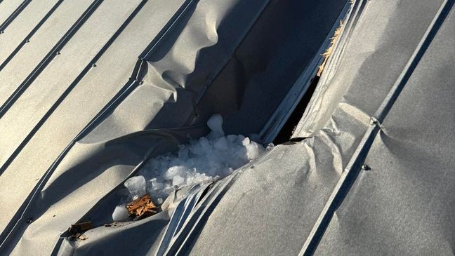 At the scene, the Fire Department discovered a large hole in the metal roof and remnants of ice had gotten into the living quarters. Photos show the damage the ice left to the home, with a large hole in the roof at the front of the house. (Palm City Fire Department)