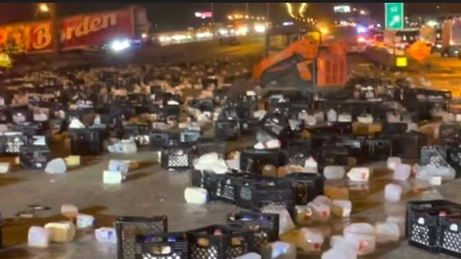 The trailer was carrying approximately 4,160 gallons of milk. Photos taken at the scene show the crates of milk littering the highway. (PBCFR) 