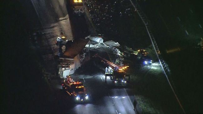 A tractor-trailer rollover crash early Tuesday morning, Oct. 22, 2024, spilled beer cans across Interstate 70 in Frederick County, shutting down all lanes. (SkyTrak7)