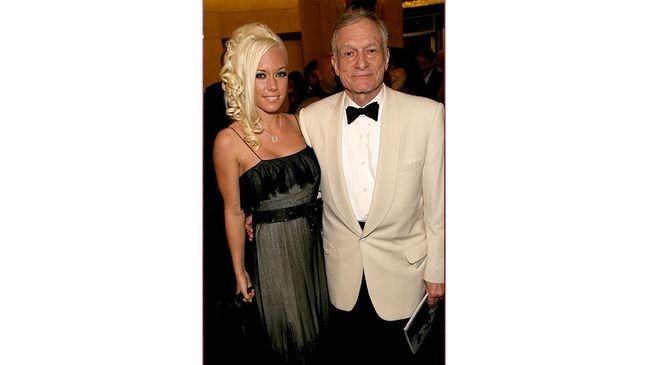HOLLYWOOD, CA - JUNE 08: Playboy's Hugh Hefner (R) and girlfriend Playmate Kendra Wilkinson depart the 34th AFI Life Achievement Award tribute to Sir Sean Connery held at the Kodak Theatre on June 8, 2006 in Hollywood, California. (Photo by Michael Buckner/Getty Images for AFI)