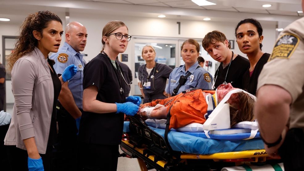 Medic Harley brings in Roxie; Medic Bashir brings in badly beaten Gus Varney. (Warrick Page/HBOMAX)