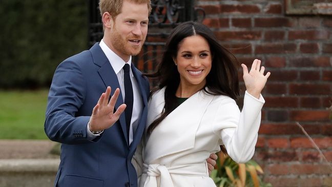 FILE - Britain's Prince Harry and his fiancee Meghan Markle pose for photographers during a photocall in the grounds of Kensington Palace in London, Monday Nov. 27, 2017.  (AP Photo/Matt Dunham, File)