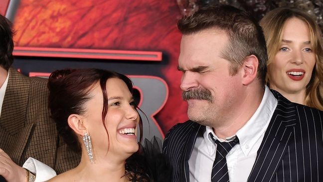 HOLLYWOOD, CALIFORNIA - NOVEMBER 06: (L-R) Millie Bobby Brown and David Harbour attend the Los Angeles Premiere of Netflix's "Stranger Things" Season 5 at TCL Chinese 6 Theatres on November 06, 2025 in Hollywood, California. (Photo by Kevin Winter/Getty Images)