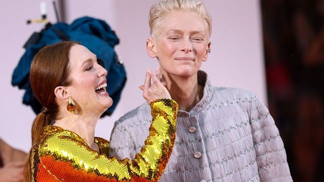 Julianne Moore, left, and Tilda Swinton pose for photographers upon arrival for the premiere of the film 'The Room Next Door' during the 81st edition of the Venice Film Festival in Venice, Italy, on Monday, Sept. 2, 2024. (Photo by Vianney Le Caer/Invision/AP)