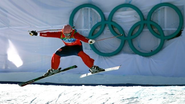 Bronze medal winner Audun Groenvold of Norway flies off the last jump of the first round in the finals of the men's ski cross competition at the Winter Olympic Games in West Vancouver, British Columbia, on Sunday. (Photo By Paul Chinn/The San Francisco Chronicle via Getty Images)
