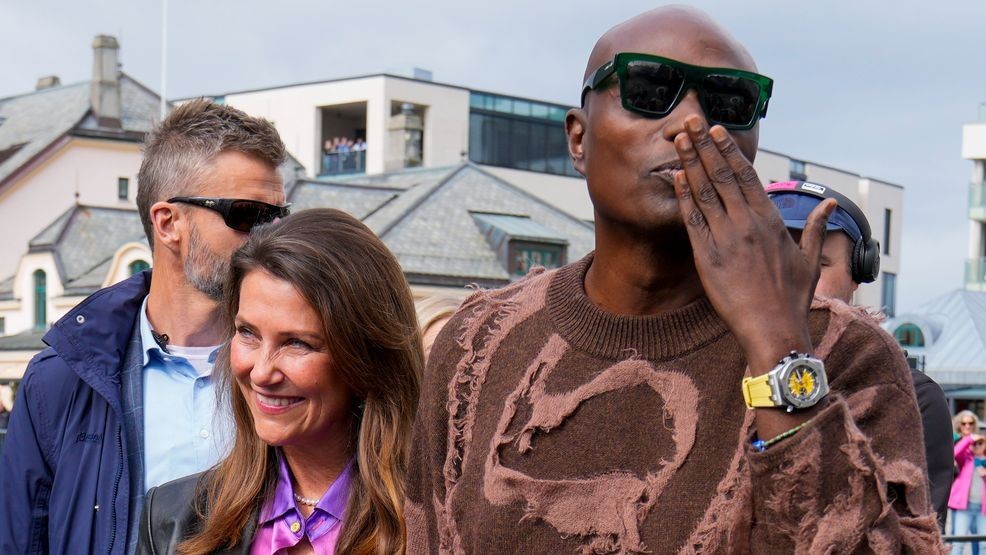 Norway's Princess Martha Louise and Durek Verret arrive at the boats in Alesund, Norway, Friday Aug. 30, 2024. that will transport them to Geiranger for their wedding celebration on Saturday. (Heiko Junge/NTB via AP)