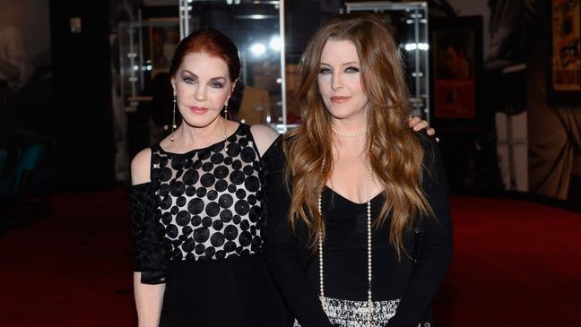 LAS VEGAS, NV - APRIL 23:  Actress Priscilla Presley (L) and singer Lisa Marie Presley attend the ribbon-cutting ceremony during the grand opening of "Graceland Presents ELVIS: The Exhibition - The Show - The Experience" at the Westgate Las Vegas Resort & Casino on April 23, 2015 in Las Vegas, Nevada.  (Photo by Bryan Steffy/WireImage)