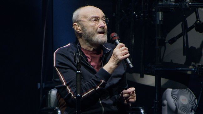 CHICAGO, ILLINOIS - NOVEMBER 15: Phil Collins of Genesis performs on the opening night of their North American "The Last Domino?" tour at the United Center on November 15, 2021 in Chicago, Illinois. (Photo by Timothy Hiatt/Getty Images)