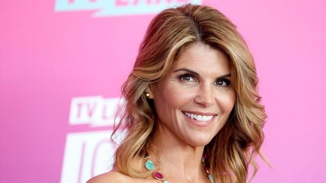 Lori Loughlin arrives at the TV Land Icon Awards in April 2016. (Credit: Rich Fury/Invision/AP, File)