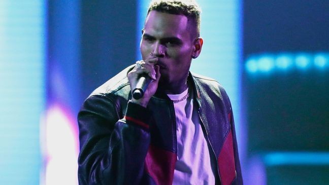 FILE - In this June 25, 2017, file photo, Chris Brown performs at the BET Awards at the Microsoft Theater in Los Angeles. Brown says he’s having a high-end yard sale at his Los Angeles home, and a crowd has been gathering for hours. (Photo by Matt Sayles/Invision/AP, File)