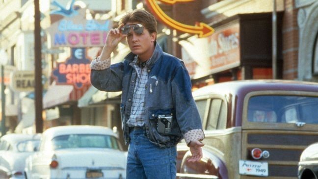 Michael J Fox walking across the street in a scene from the film 'Back To The Future', 1985. (Photo by Universal/Getty Images)