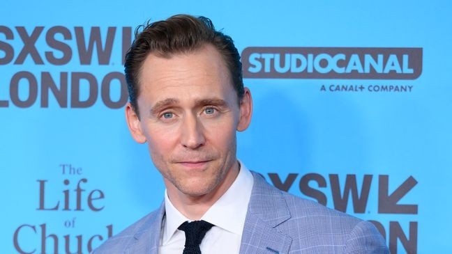 Tom Hiddleston played it cool when his ex, Taylor Swift, came up during an interview. (Photo by Karwai Tang/WireImage)