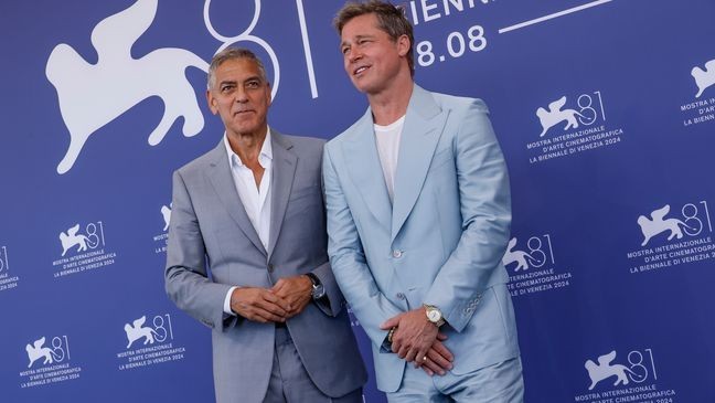 George Clooney, left, and Brad Pitt pose for photographers at the photo call for the film 'Wolfs' during the 81st edition of the Venice Film Festival in Venice, Italy, on Sunday, Sept. 1, 2024. (Photo by Joel C Ryan/Invision/AP)