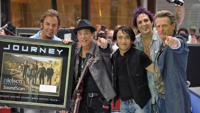 NEW YORK, NY - JULY 29:  (L-R) keyboard player Jonathan Cain, guitar player Neal Schon, singer Arnel Pineda, drummer Deen Castronovo, and bass player Ross Valory of the band Journey performs\ at the 2011 Today Summer Concert series at Rockefeller Plaza on July 29, 2011 in New York City.  (Photo by Mike Coppola/Getty Images)