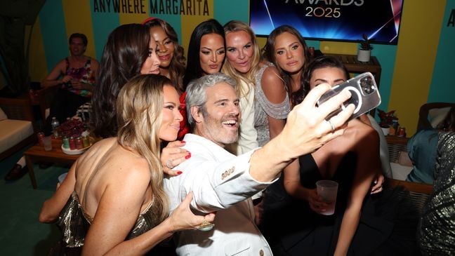 LOS ANGELES, CALIFORNIA - JULY 17: (clockwise from L) Britani Bateman, Angie Katsanevas, Mary Cosby, Lisa Barlow, Heather Gay, Meredith Marks, and Andy Cohen attend Las Culturistas Culture Awards Teal Room with Casamigos Margaritas at The Orpheum Theatre on July 17, 2025 in Los Angeles, California. (Photo by Jerritt Clark/Getty Images for Casamigos Margaritas)