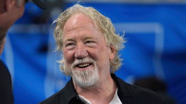 FILE - Actor Timothy Busfield smiles before an NFL football game in Detroit, Sept. 14, 2025. (AP Photo/Paul Sancya, File)
