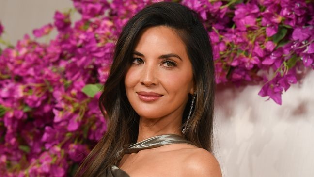 Olivia Munn intially sparked controversy after saying she doesn't let her and Mulaney's kids watch Ms. Rachel. (Photo by Gregg DeGuire/WWD via Getty Images)